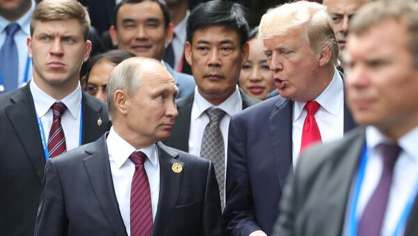 Russian President Vladimir Putin and US President Donald Trump are seen here ahead of the first working meeting of the Asia-Pacific Economic Cooperation leaders - Sputnik International