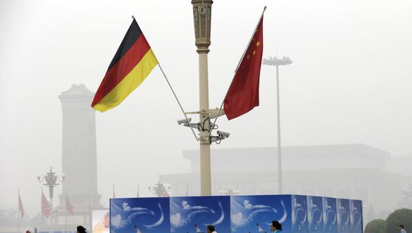 German and Chinese national flags are attached to a lamp post on Tiananmen Square (File) - Sputnik International