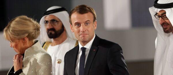 French President Emmanuel Macron gestures as he is welcomed by Abu Dhabi Crown Prince Sheikh Mohammed bin Zayed al-Nahyan and Prime Minister and Vice-President of UAE and Ruler of Dubai Sheikh Mohammed bin Rashid al-Maktoum upon Macron's arrival with his wife at the Louvre Abu Dhabi, in Abu Dhabi, UAE, November 8, 2017 French President Emmanuel Macron gestures as he is welcomed by Abu Dhabi Crown Prince Sheikh Mohammed bin Zayed al-Nahyan and Prime Minister and Vice-President of UAE and Ruler of Dubai Sheikh Mohammed bin Rashid al-Maktoum upon Macron's arrival with his wife at the Louvre Abu Dhabi, in Abu Dhabi, UAE, November 8, 2017 - Sputnik International