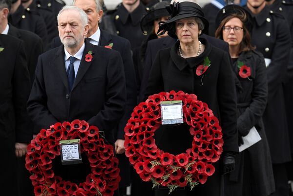 Britain's Prime Minister Theresa May and Leader of the opposition Labour Party Jeremy Corbyn wait to lay wreathes at the Remembrance Sunday Cenotaph service in London, Britain, November 12, 2017 - Sputnik International