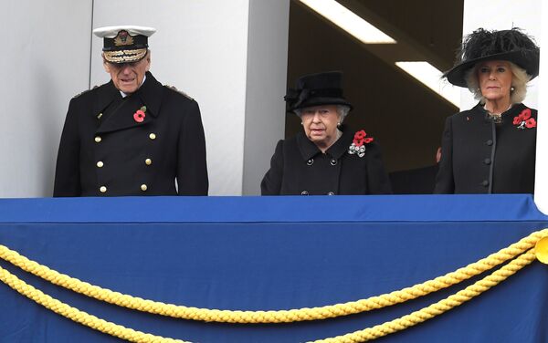 Britain's Queen Elizabeth II (C), Prince Philip, Duke of Edinburgh (L) and Camilla, Duchess of Cornwall attend the Remembrance Sunday Cenotaph service in London, Britain, November 12, 2017 - Sputnik International