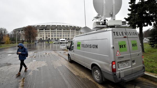 A Russia's Russia Today (RT) television broadcast van is seen parked outside the Luzhniki stadium ahead of an international friendly football match between Russia and Argentina in Moscow on November 11, 2017 - Sputnik International