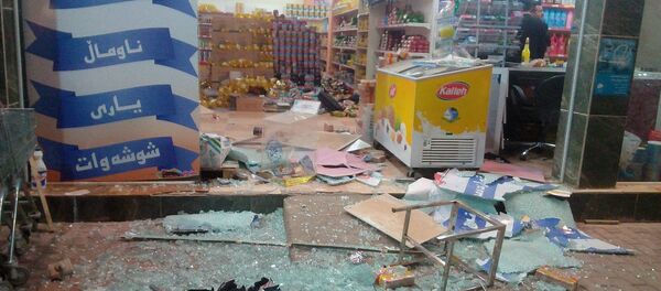 A damaged storefront is seen after an earthquake in Halabja, Iraq, November 12, 2017 A damaged storefront is seen after an earthquake in Halabja, Iraq, November 12, 2017 - Sputnik International