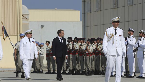French President Emmanuel Macron reviews the French honor guard at the naval base during his second day of visit in Abu Dhabi, United Arab Emirates, Thursday, Nov. 9, 2017 - Sputnik International