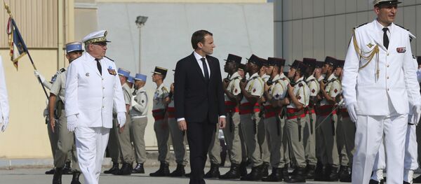 French President Emmanuel Macron reviews the French honor guard at the naval base during his second day of visit in Abu Dhabi, United Arab Emirates, Thursday, Nov. 9, 2017 - Sputnik International