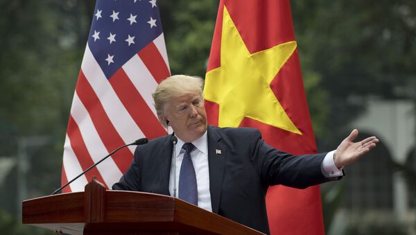 US President Donald Trump talks during a joint press conference with Vietnamese President Tran Dai Quang in Hanoi on November 12, 2017 - Sputnik International