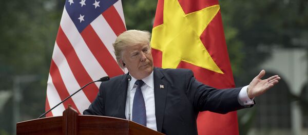 US President Donald Trump talks during a joint press conference with Vietnamese President Tran Dai Quang in Hanoi on November 12, 2017 - Sputnik International