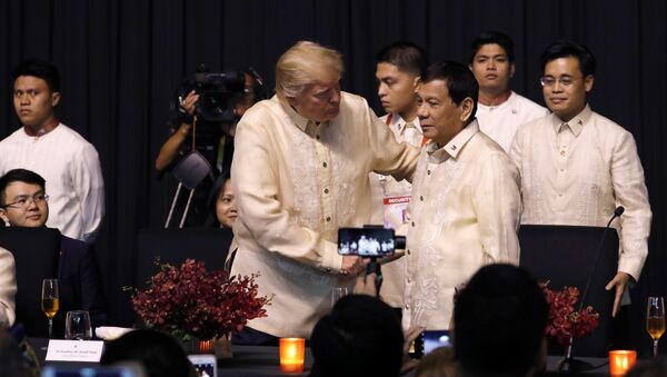 U.S. President Donald Trump shakes hands with Philippines President Rodrigo Duterte during the gala dinner marking ASEAN's 50th anniversary in Manila, Philippines November 12, 2017 - Sputnik International