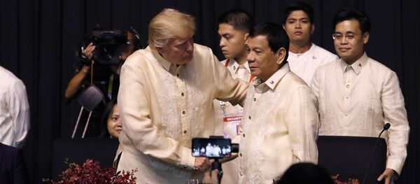 U.S. President Donald Trump shakes hands with Philippines President Rodrigo Duterte during the gala dinner marking ASEAN's 50th anniversary in Manila, Philippines November 12, 2017 - Sputnik International