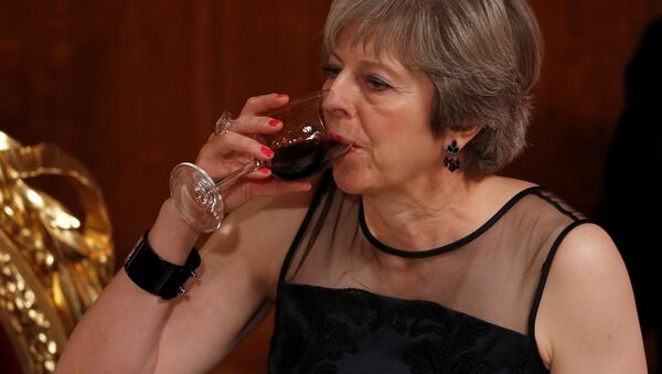 Britain's Prime Minister Theresa May drinks a toast at the Lord Mayor's Banquet at the Guildhall, in London, Britain - Sputnik International