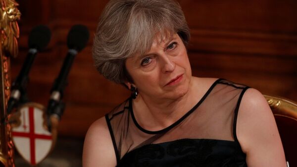 Britain's Prime Minister Theresa May listens to a speech at the Lord Mayor's Banquet at the Guildhall, in London, Britain November 13, 2017. - Sputnik International