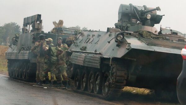 Soldiers stand beside military vehicles just outside Harare, Zimbabwe - Sputnik International