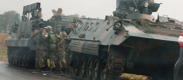 Soldiers stand beside military vehicles just outside Harare, Zimbabwe Soldiers stand beside military vehicles just outside Harare, Zimbabwe - Sputnik International