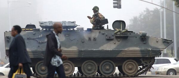 An armed soldier patrols a street in Harare, Zimbabwe, Wednesday, Nov. 15, 2017 - Sputnik International