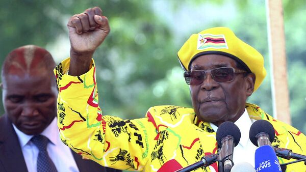 In this Nov. 8, 2017, file photo, Zimbabwe's President Robert Mugabe, left, and his wife Grace Mugabe chant the party's slogan during a solidarity rally in Harare, Zimbabwe. - Sputnik International