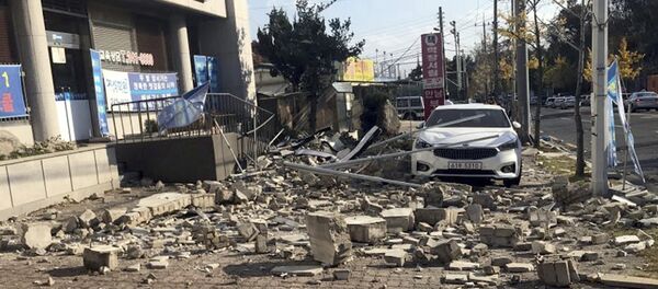 Debris from a collapsed wall is scattered in front of a shop after an earthquake in Pohang, South Korea Debris from a collapsed wall is scattered in front of a shop after an earthquake in Pohang, South Korea - Sputnik International