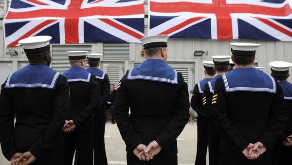 Submariners stand to attention during a ceremony to officially make 'Artful' a commissioned warship of the Royal Navy at Faslane Naval Base, Rhu, Scotland on March 18, 2016. - Sputnik International