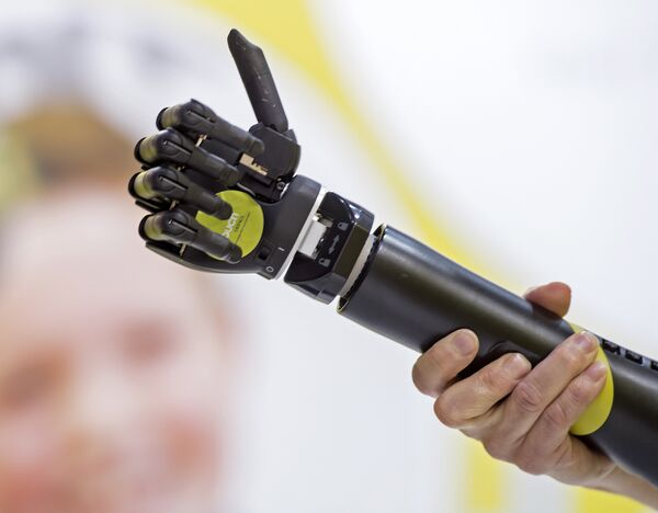 A man presents the bionic prosthesis 'i-limb quantum'at the stand of the company Touch Bionics of Great Britain during the international trade show and world congress OTWorld in Leipzig, eastern Germany. (File) A man presents the bionic prosthesis 'i-limb quantum'at the stand of the company Touch Bionics of Great Britain during the international trade show and world congress OTWorld in Leipzig, eastern Germany. (File) - Sputnik International