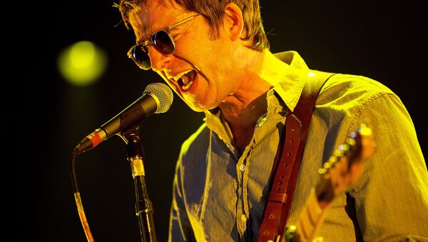 Noel Gallagher performs on stage with his band High Flying Birds, playing at The Roskilde Festival which opened on Wednesday, July 1, 2015.  - Sputnik International
