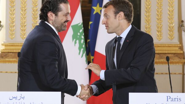 In this Sept. 1 2017 file photo, French President Emmanuel Macron, right, shakes hands with Lebanese Prime Minister Saad Hariri during a joint press conference at the Elysee Palace in Paris. - Sputnik International