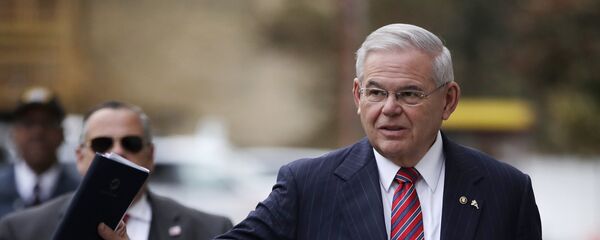 U.S. Sen. Bob Menendez waves at reporters before entering the Martin Luther King Jr. Federal Courthouse for his federal corruption trial, Thursday, Nov. 16, 2017, in Newark, N.J. Jury deliberations continued on Thursday morning. U.S. Sen. Bob Menendez waves at reporters before entering the Martin Luther King Jr. Federal Courthouse for his federal corruption trial, Thursday, Nov. 16, 2017, in Newark, N.J. Jury deliberations continued on Thursday morning. - Sputnik International