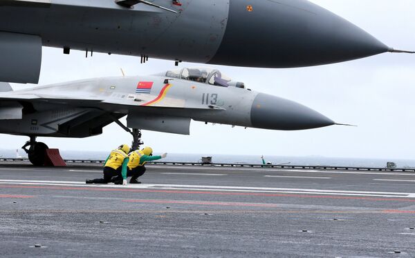 This photo taken on January 2, 2017 shows Chinese J-15 fighter jets on the deck of the Liaoning aircraft carrier during military drills in the South China Sea - Sputnik International