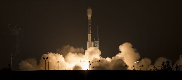 This photo provided by NASA, A Delta 2 rocket carrying the Soil Moisture Active Passive, SMAP ,satellite launches early Saturday, Jan. 31, 2015 from Vandenberg Air Force Base, Calif. - Sputnik International