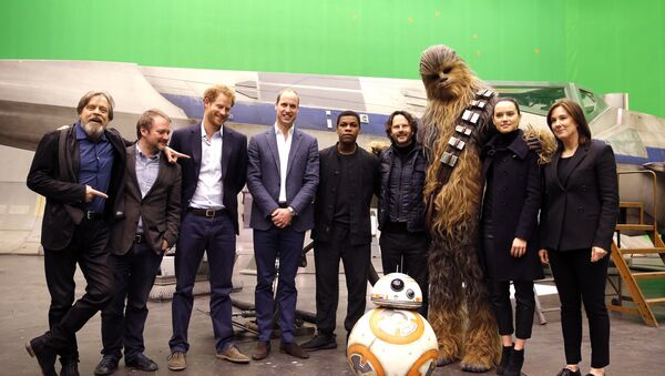 US actor Mark Hamill, US director Rian Johnson, Britain's Prince Harry, Britain's Prince William, British actor John Boyega, character Chewbacca and British actress Daisy Ridley, from left, and droid BB-8 pose for a photo during a tour of the Star Wars sets at Pinewood studios in Iver Heath, west London, Tuesday April 19, 2016 - Sputnik International