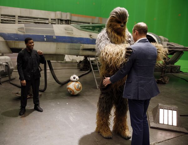 Britain's Prince William talks with the Star Wars character Chewbacca during a tour of the Star Wars sets at Pinewood studios in Iver Heath, west of London on Tuesday April 19, 2016 Britain's Prince William talks with the Star Wars character Chewbacca during a tour of the Star Wars sets at Pinewood studios in Iver Heath, west of London on Tuesday April 19, 2016 - Sputnik International