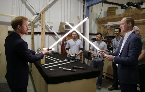 Britain's Prince William, right, and Prince Harry use light sabres during a tour of the Star Wars sets at Pinewood studios in Iver Heath, west London, Tuesday April 19, 2016 Britain's Prince William, right, and Prince Harry use light sabres during a tour of the Star Wars sets at Pinewood studios in Iver Heath, west London, Tuesday April 19, 2016 - Sputnik International
