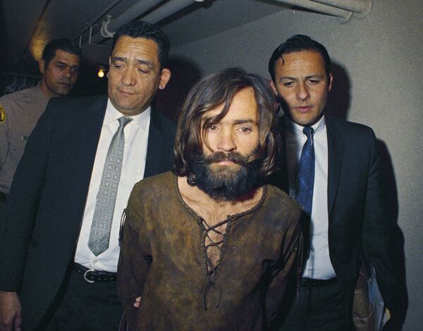 In this 1969 file photo, Charles Manson is escorted to his arraignment on conspiracy-murder charges in connection with the Sharon Tate murder case In this 1969 file photo, Charles Manson is escorted to his arraignment on conspiracy-murder charges in connection with the Sharon Tate murder case - Sputnik International