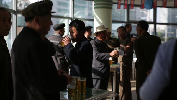 In this Saturday, May 7, 2016, photo, North Korean men drink beer at the Taedonggang Beer shop in Pyongyang, North Korea - Sputnik International