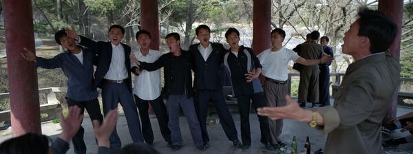 In this April 18, 2012 photo, North Korean men drink and sing inside a pagoda at a hilltop park overlooking Pyongyang - Sputnik International