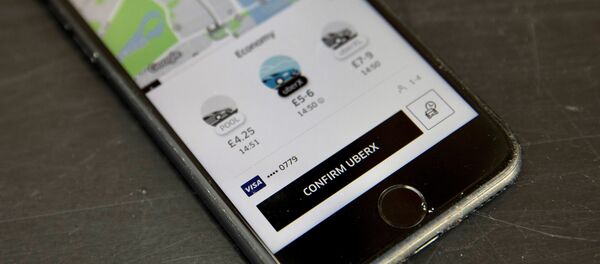A photo illustration shows the Uber app on a mobile telephone, as it is held up for a posed photograph, in London, Britain November 10, 2017. - Sputnik International