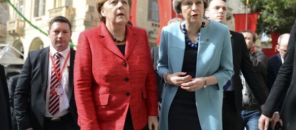 German Chancellor Angela Merkel, left, speaks with British Prime Minister Theresa May, right, as they walk with other EU leaders during an event at an EU summit in Valletta, Malta, on Friday, Feb. 3, 2017. German Chancellor Angela Merkel, left, speaks with British Prime Minister Theresa May, right, as they walk with other EU leaders during an event at an EU summit in Valletta, Malta, on Friday, Feb. 3, 2017. - Sputnik International