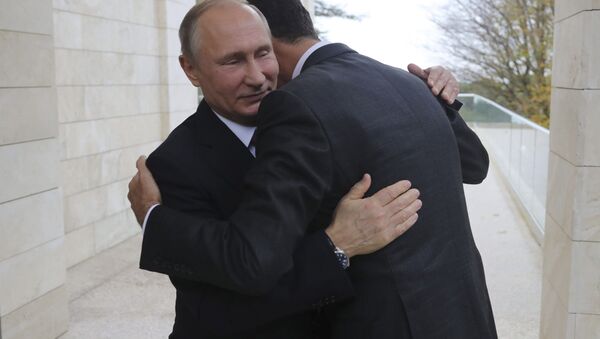 Russian President Vladimir Putin (L) welcomes Syrian President Bashar al-Assad during a meeting in the Black Sea resort of Sochi, Russia November 20, 2017. Picture taken November 20, 2017 - Sputnik International