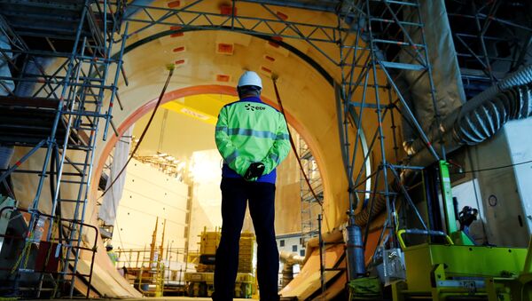 A worker stands in the construction site of the third-generation European Pressurised Water nuclear reactor (EPR) in Flamanville, northwestern France on November 16, 2016 - Sputnik International