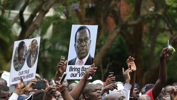 Protesters hold posters showing support for former vice-President Emmerson Mnangagwa, in Harare, Zimbabwe, November 18, 2017 - Sputnik International
