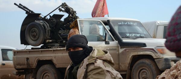 Fighters from the Free Syrian Army take a break during battles against Islamic State (IS) group jihadists near the town of Qabasin, located northeast of the city of Al-Bab, some 30 kilometres from Aleppo, on January 8, 2017 - Sputnik International