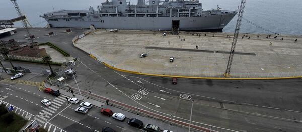 British soldiers board the Royal Navy warship HMS Albion, background, at Santander's port, northern Spain, on Tuesday, April 20, 2010. The warship came to take back to England nearly 800 British soldiers and civilians stranded by the volcanic ash cloud. British soldiers board the Royal Navy warship HMS Albion, background, at Santander's port, northern Spain, on Tuesday, April 20, 2010. The warship came to take back to England nearly 800 British soldiers and civilians stranded by the volcanic ash cloud. - Sputnik International