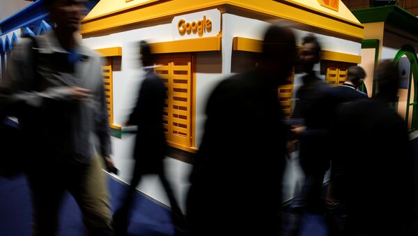 People pass by the Google stand at the Web Summit, Europe's biggest tech conference, in Lisbon, Portugal, November 8, 2017 - Sputnik International