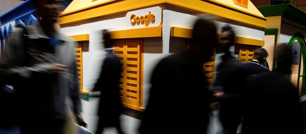 People pass by the Google stand at the Web Summit, Europe's biggest tech conference, in Lisbon, Portugal, November 8, 2017 - Sputnik International
