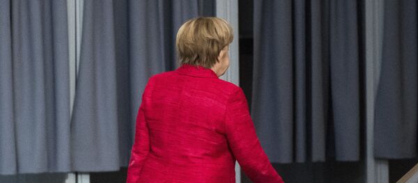 German Chancellor Angela Merkel leaves a plenary session of German parliament Bundestag in Berlin, Tuesday, Nov. 21, 2017 - Sputnik International