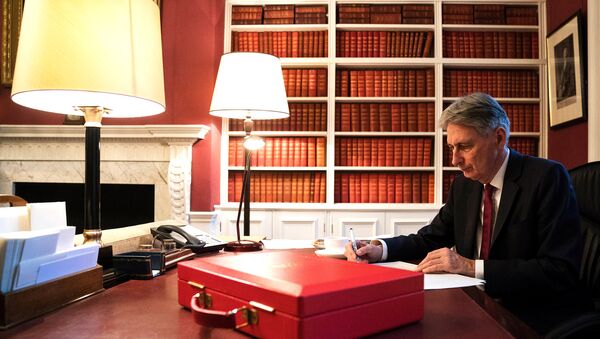 Britain's Finance Minister Philip Hammond prepares his 2017 budget speech in his office in Downing Street, London - Sputnik International
