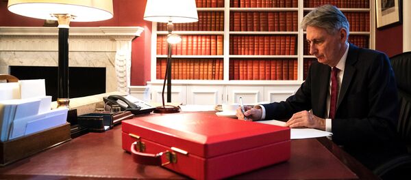 Britain's Finance Minister Philip Hammond prepares his 2017 budget speech in his office in Downing Street, London Britain's Finance Minister Philip Hammond prepares his 2017 budget speech in his office in Downing Street, London - Sputnik International
