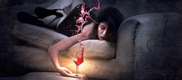 A woman drinking red wine A woman drinking red wine - Sputnik International