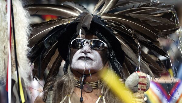 A Native American dancer participates during the Grand Entry of the 43rd Annual Denver March Powwow held at the Denver Coliseum on March 25, 2017 in Denver, Colorado - Sputnik International