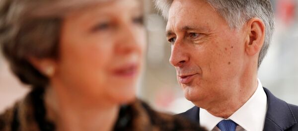 Britain's Prime Minister Theresa May and Chancellor of the Exchequer Philip Hammond visit an engineering training facility in the West Midlands, November 20, 2017. - Sputnik International