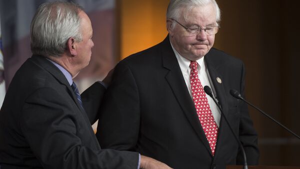 US Representative Joe Barton (R), Republican of Texas and coach of the US House Republican baseball team, tells the story of the shooting against the Republican Congressional baseball team alongside US Representative Mike Doyle (L), Democrat of Pennsylvania and coach of the US House Democratic baseball team, during a press conference on Capitol Hill in Washington, DC, June 14, 2017 - Sputnik International