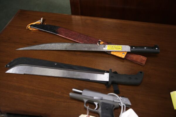Weapons on display at the U.S. Attorney's office following the arrests of gang members in Boston, Friday, Jan. 29, 2016. Authorities say they have charged 56 members of the MS-13 gang in and around Boston. The gang is notoriously violent and known for using machetes to kill victims. According to court documents, in 2012, MS-13 became the first and remains the only street gang to be designated by the U.S. government as a transnational criminal organization. Weapons on display at the U.S. Attorney's office following the arrests of gang members in Boston, Friday, Jan. 29, 2016. Authorities say they have charged 56 members of the MS-13 gang in and around Boston. The gang is notoriously violent and known for using machetes to kill victims. According to court documents, in 2012, MS-13 became the first and remains the only street gang to be designated by the U.S. government as a transnational criminal organization. - Sputnik International